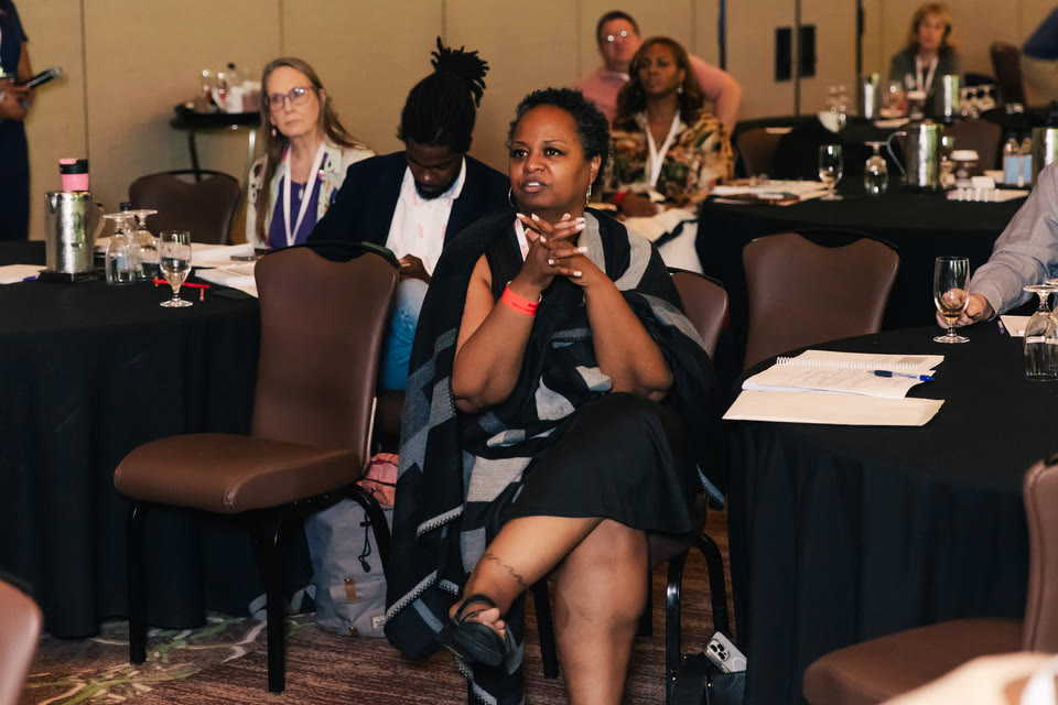 Attendee engaged in a working session at the conference.