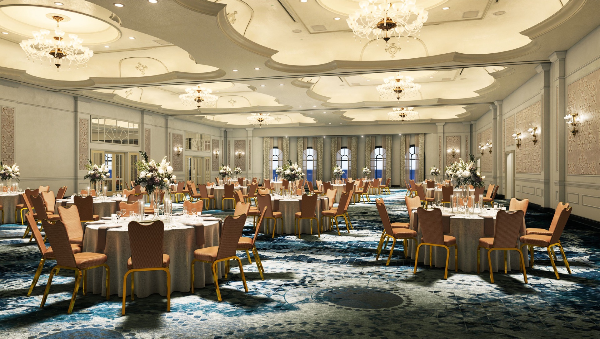 Venetian Ballroom at Loews Portofino Bay — banquet setup with chandeliers, ornate ceiling, and the signature blue geometric carpet.